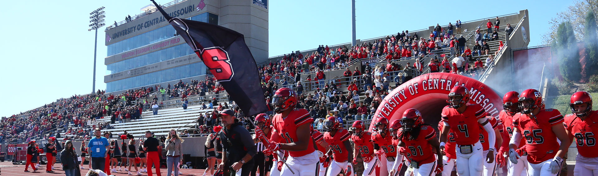 The UCM football team taking the field